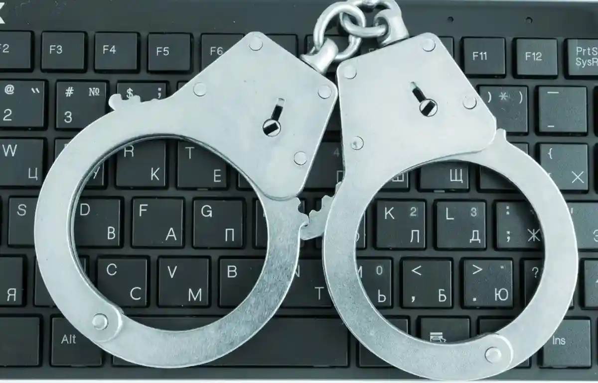 Handcuffs on computer keyboard