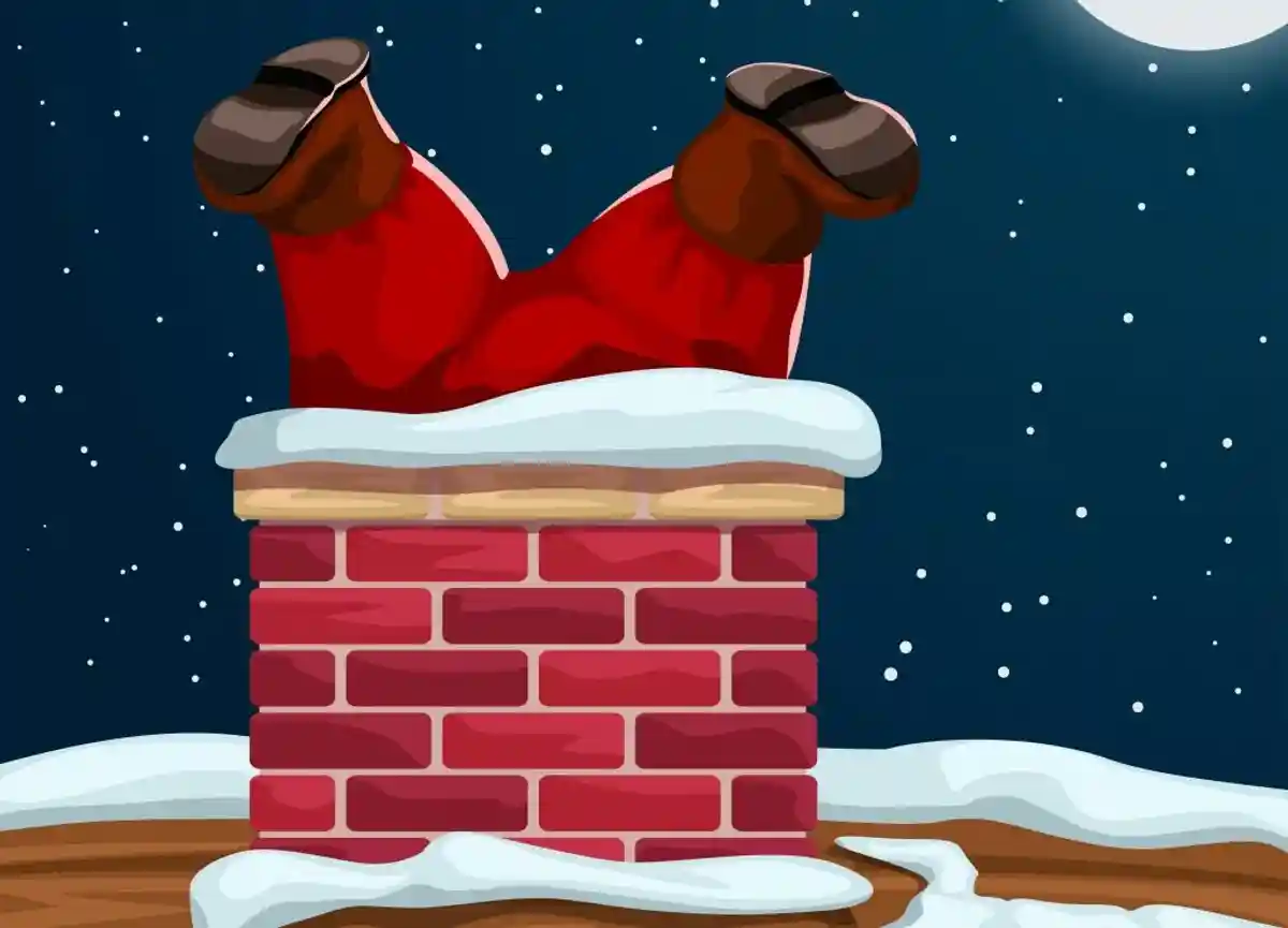 Дед Мороз лезет в трубу. Фото: shutterstock.com