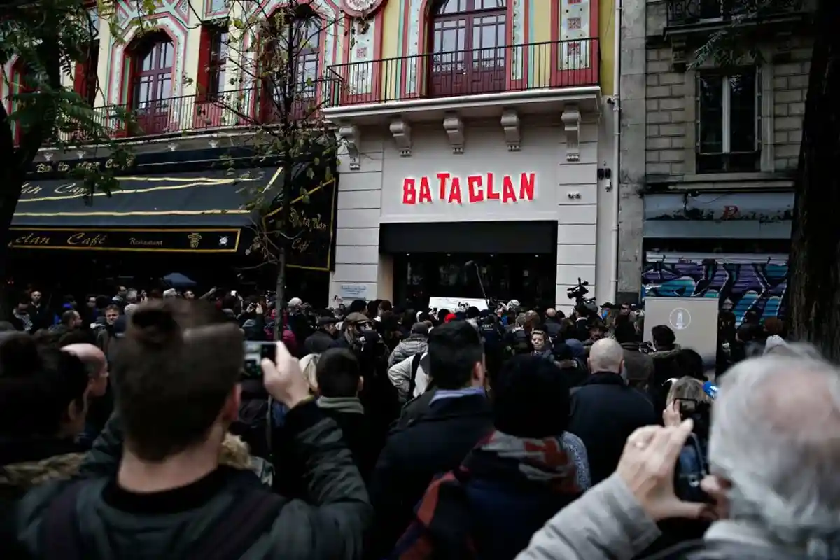 People pay their respects to the victims of the attack on the Bataclan, Paris