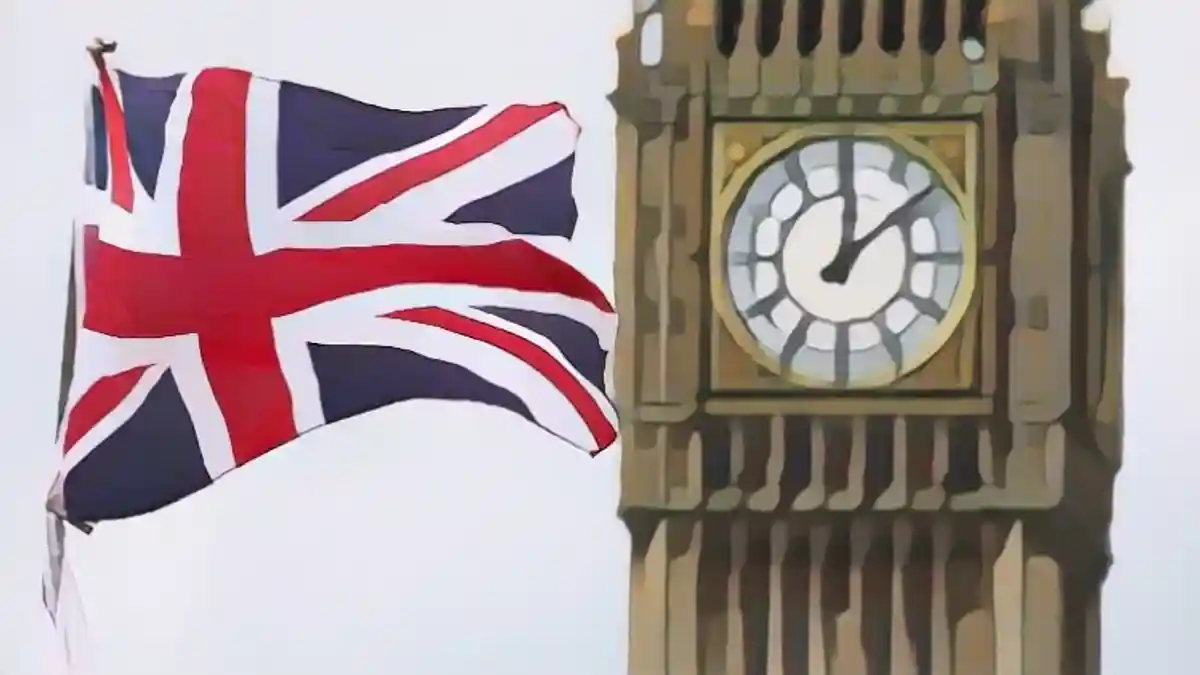 Британский флаг развевается перед знаменитой часовой башней Биг-Бен в Лондоне:Британский флаг развевается перед знаменитой часовой башней Биг-Бен в Лондоне.