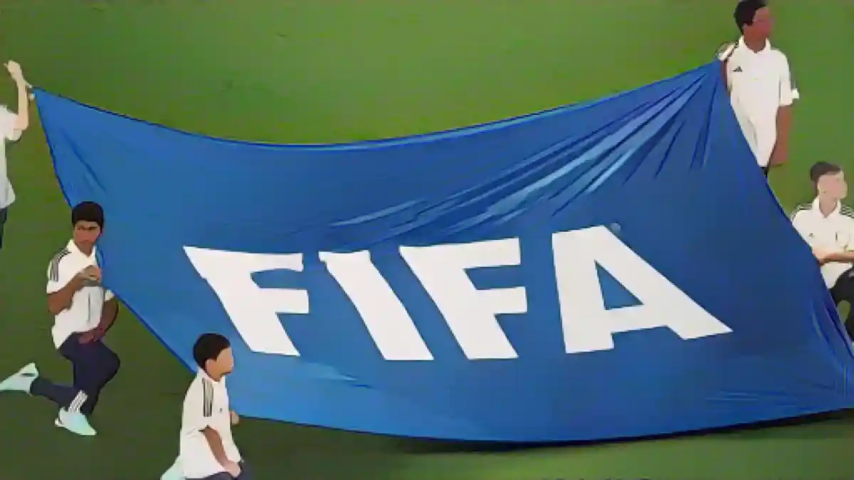 Дети держат баннер с надписью "FIFA".:Дети держат баннер с надписью "FIFA". Фото