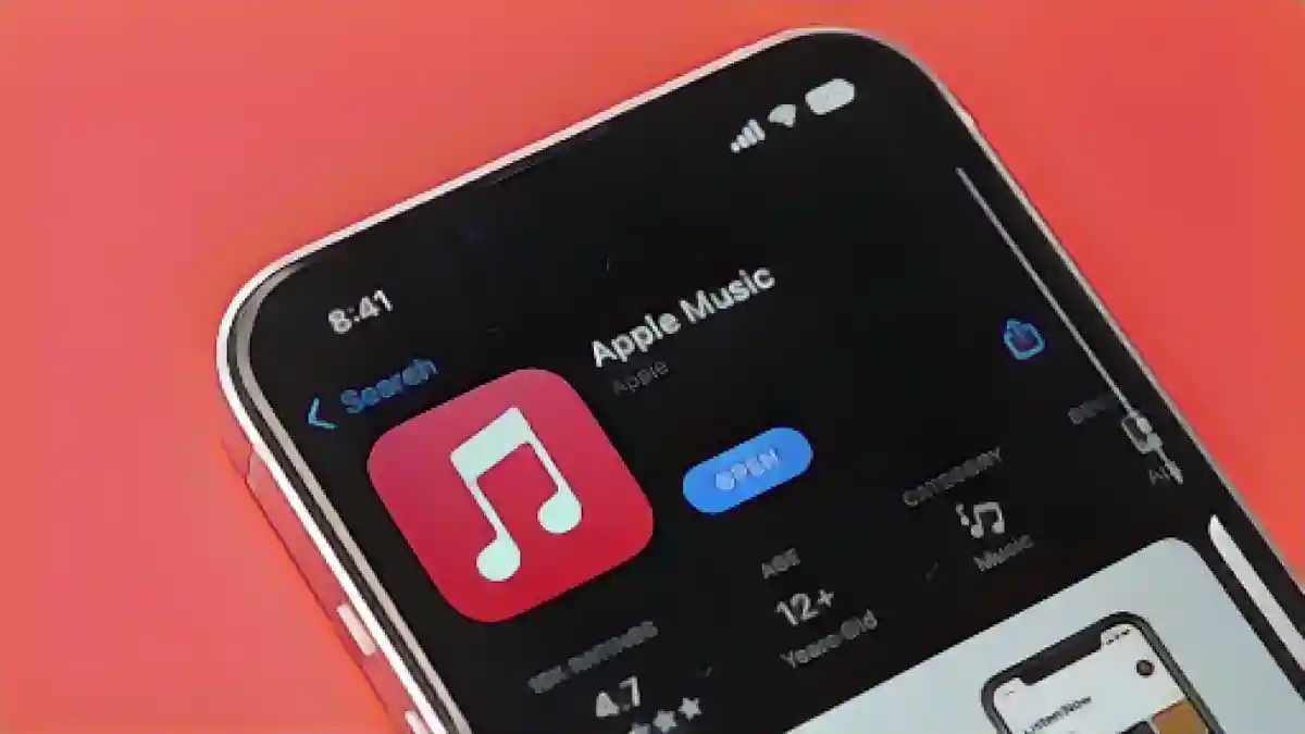 iPhone с листингом магазина приложений Apple Music на экране:Как скачать песни из Apple Music для прослушивания в автономном режиме