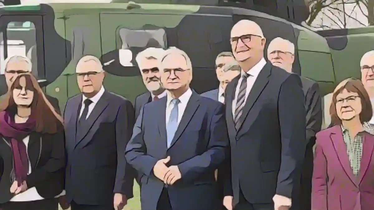Райнер Хазелофф (ХДС, 5-й слева), министр-президент Саксонии-Анхальт, и Дитмар Войдке (СДПГ, справа), министр-президент Саксонии-Анхальт.:Райнер Хазелофф (ХДС, 5-й слева), министр-президент Саксонии-Анхальт, и Дитмар Войдке (СДПГ, справа), министр-президент Бранденбурга, стоят перед вертолетом вместе со своими членами кабинета министров перед началом совместного заседания кабинета министров на авиабазе Хольцдорф-Шёневальде. Фото