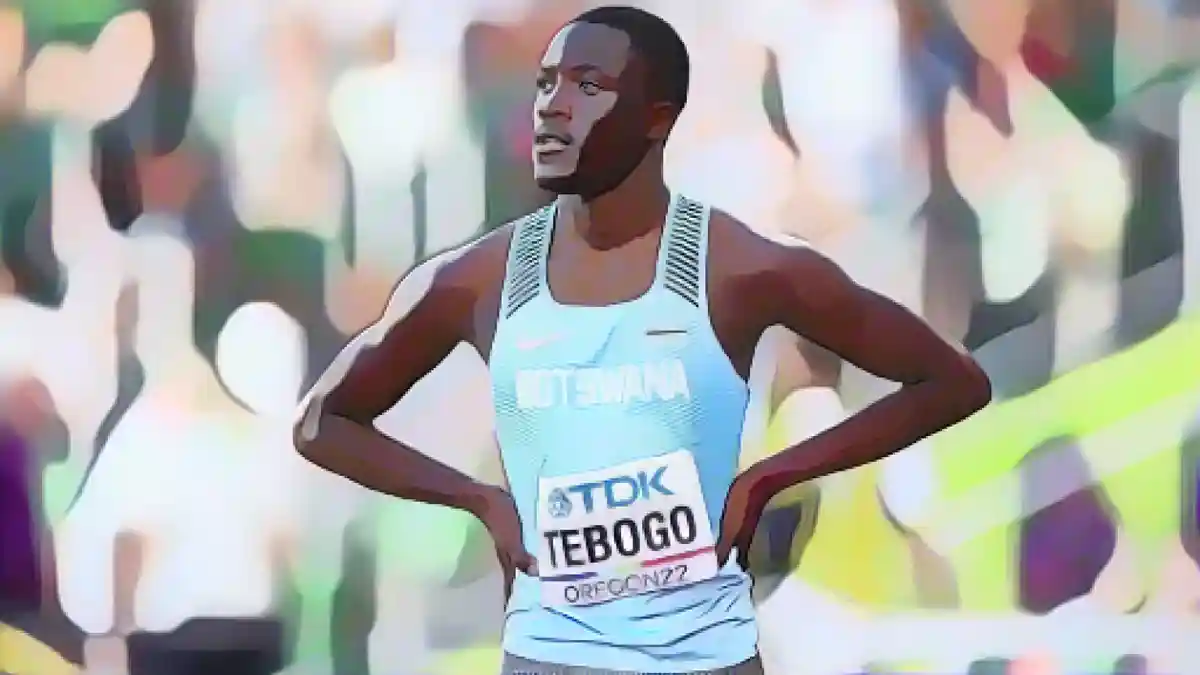 Тебого наблюдает за ходом забега на 100 метров на чемпионате мира по легкой атлетике в Орегоне.:Тебого наблюдает за ходом забега на 100 метров на чемпионате мира по легкой атлетике в Орегоне.